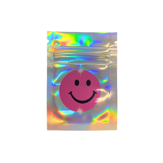 Holographic mylar bag with a pink smiley face design